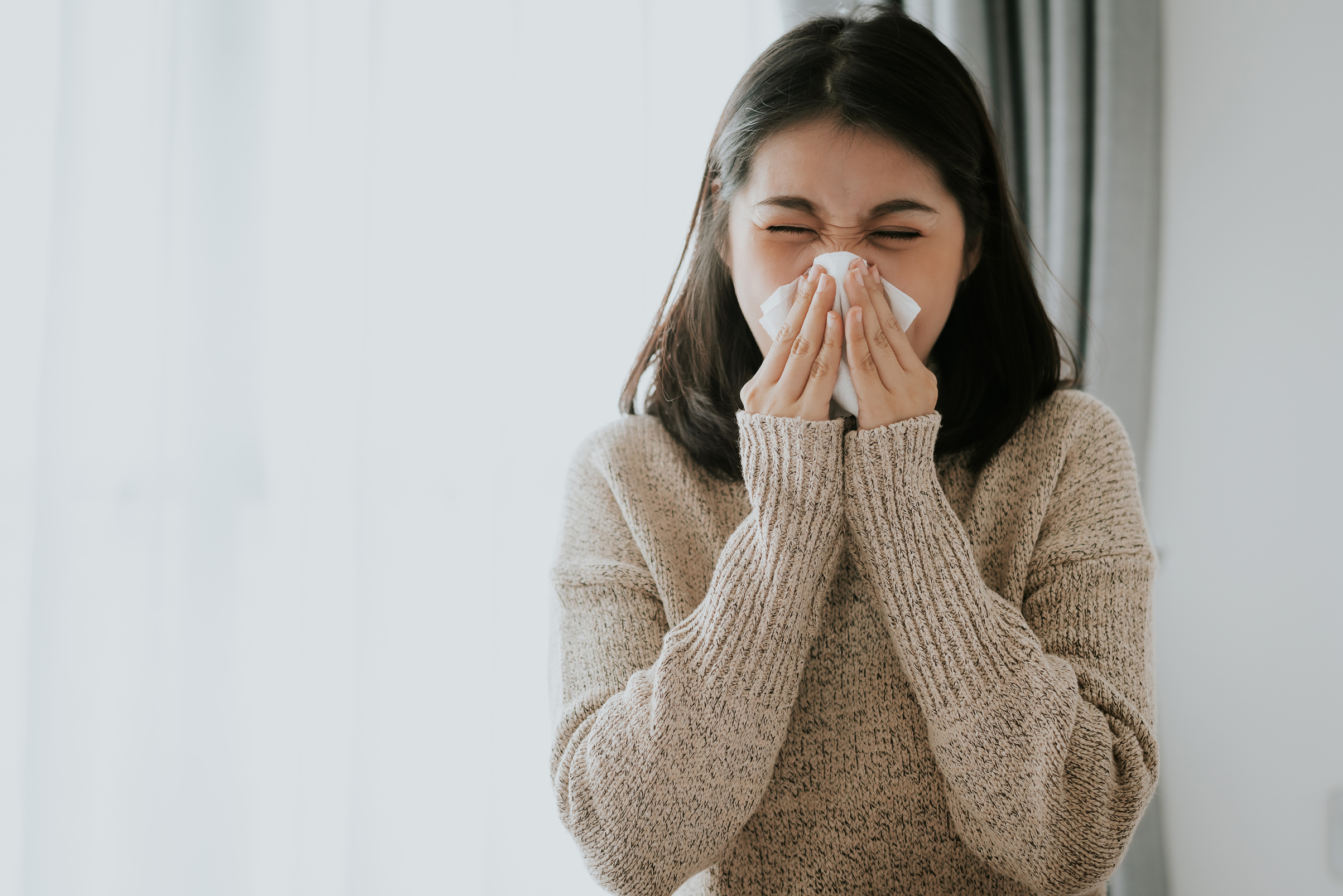 Sick Woman Sneeze on Tissue 